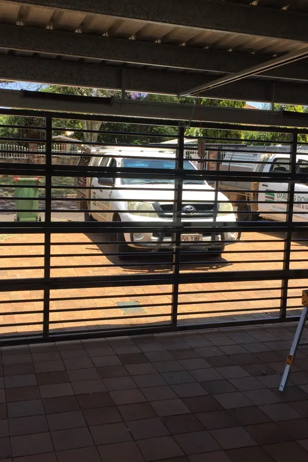 after Black Powder-coated Aluminium Custom Door – Bar Grille, South Toowoomba