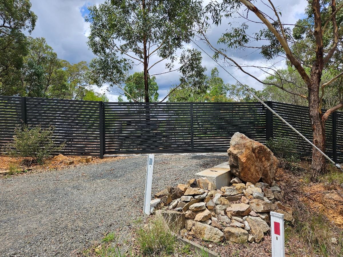 after Monument Colorbond Steel Sliding Gate – Slide Gate + Motor (Monument 1800x5000 Horizontal Slat + Infill Panels + LV Motor + Steel Return), Cabarlah