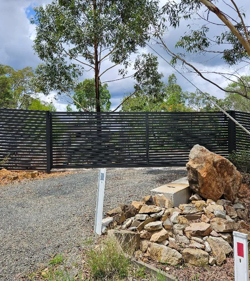 after Monument Colorbond Steel Sliding Gate – Slide Gate + Motor (Monument 1800x5000 Horizontal Slat + Infill Panels + LV Motor + Steel Return), Cabarlah