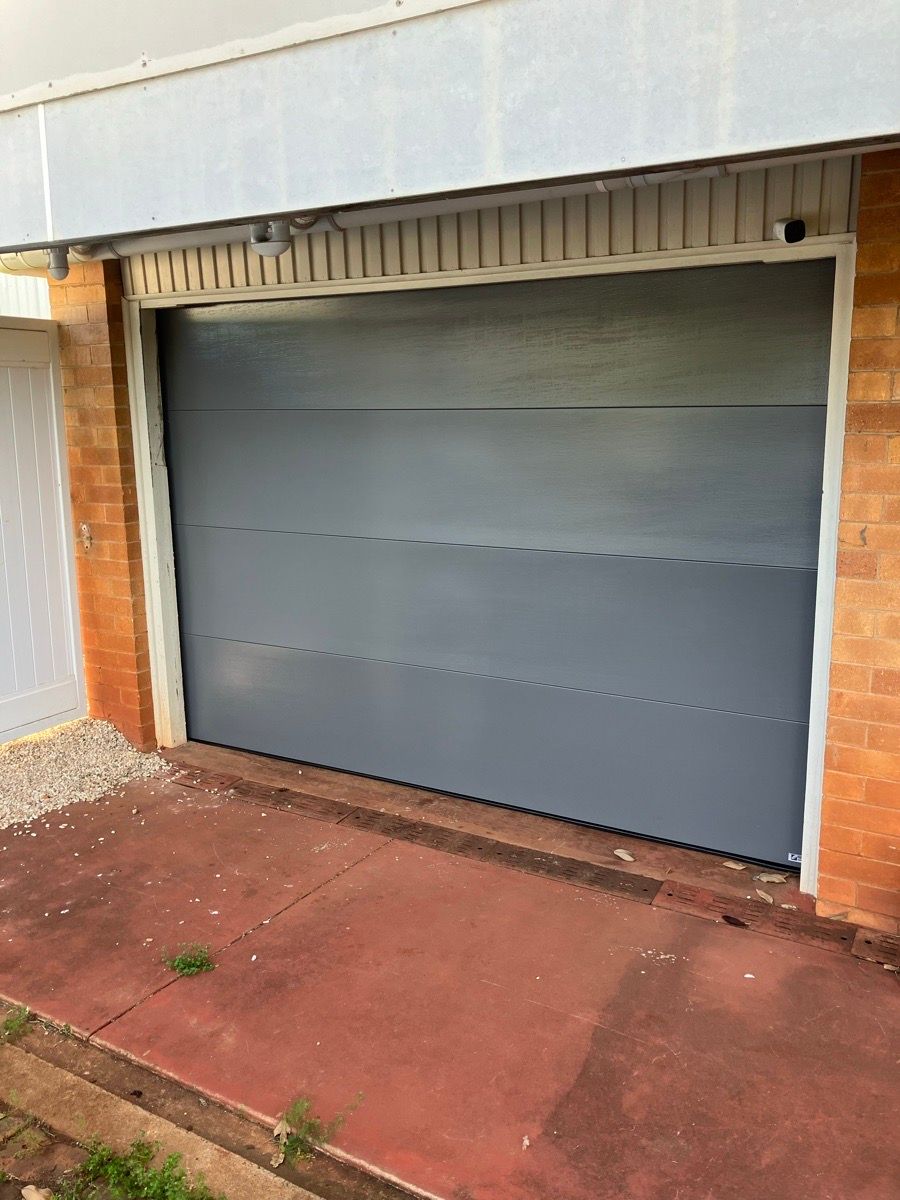 after Basalt Colorbond Steel Sectional Door – PD Impact, Centenary Heights
