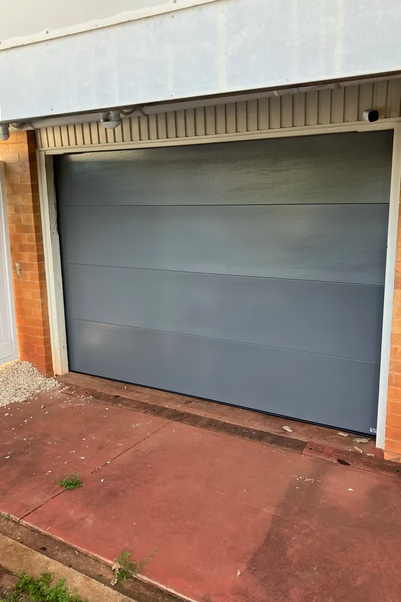 after Basalt Colorbond Steel Sectional Door – PD Impact, Centenary Heights