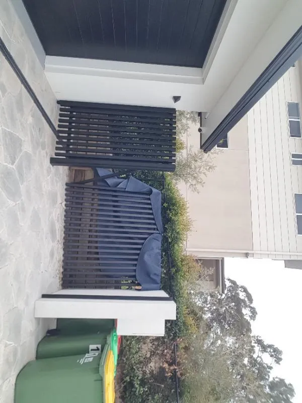 after Black Powder-coated Aluminium Custom Door – INSTALL: Bin enclosure gates, Prince Henry Heights