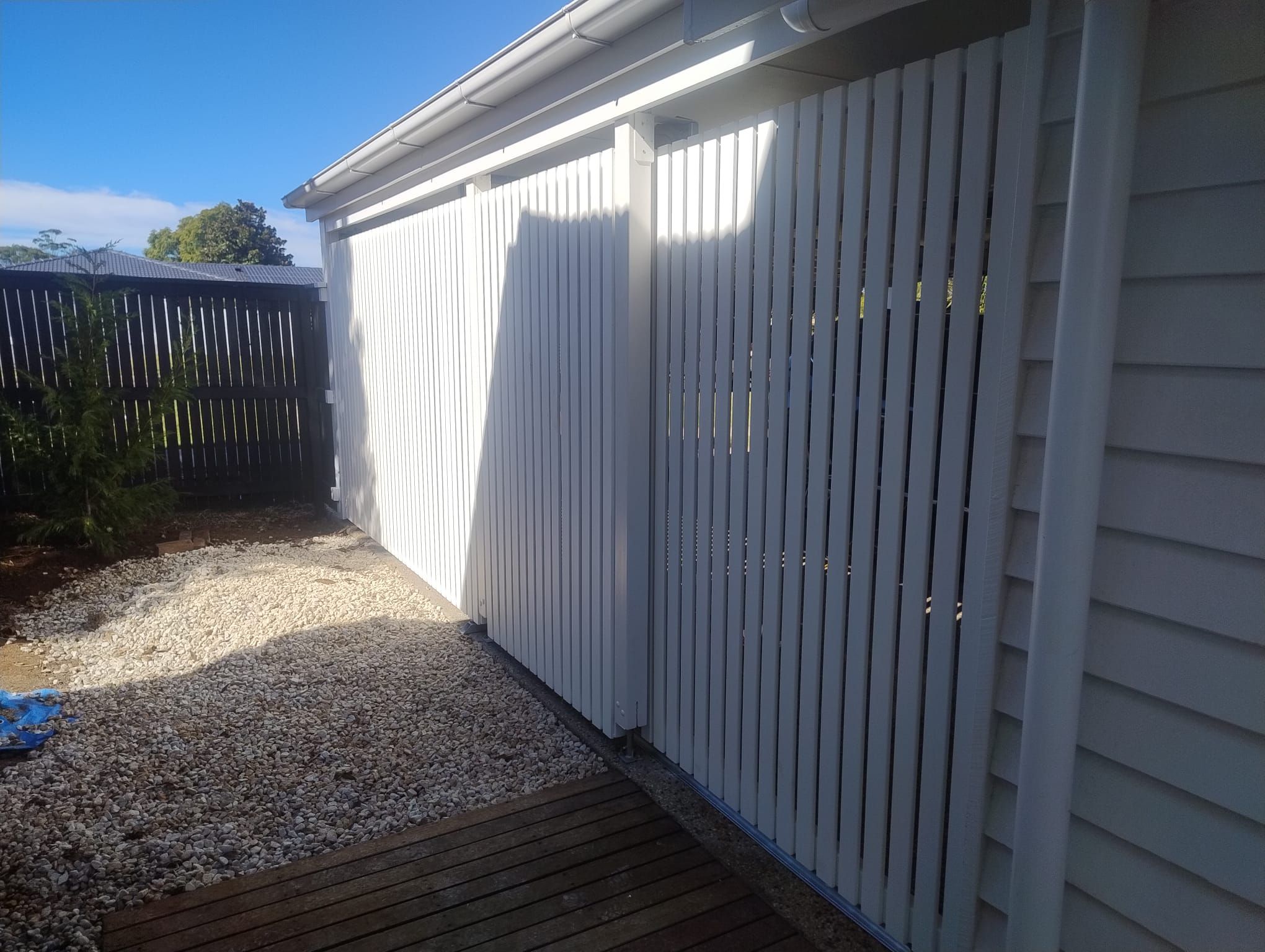 after Pro Texture White Powder-coated Aluminium Custom Door – Slat Screening, East Toowoomba
