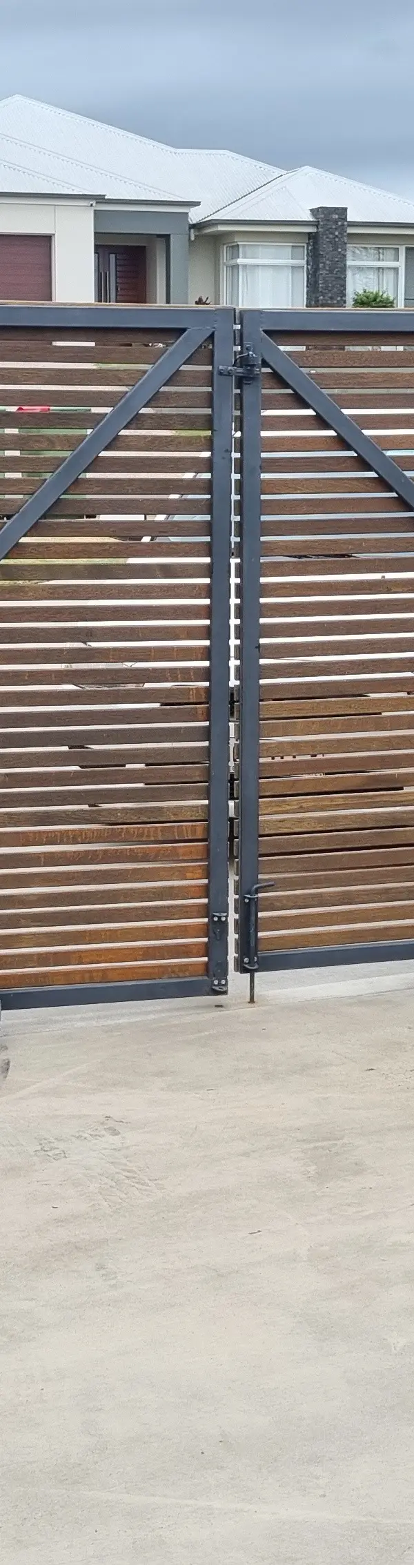 after Wood-look + Black Timber + Powder-coated Steel Sliding Gate – Gate Fabrication, Highfields