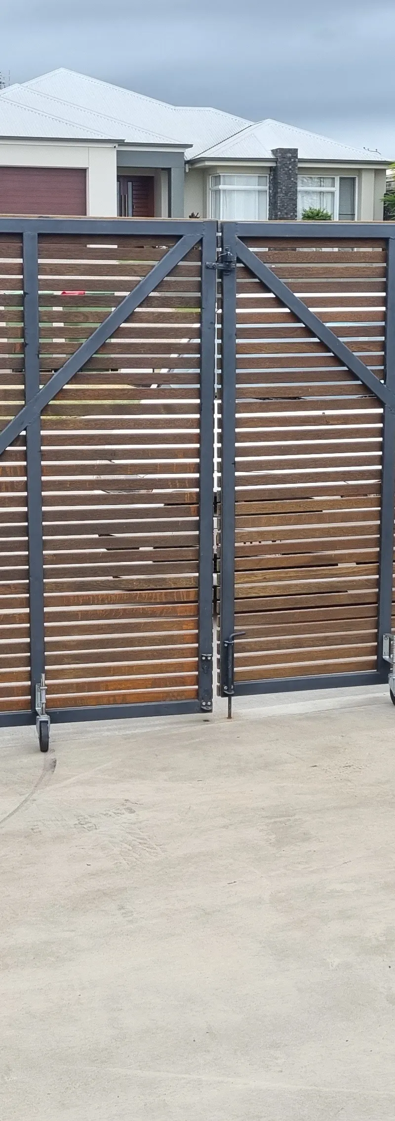 after Wood-look + Black Timber + Powder-coated Steel Sliding Gate – Gate Fabrication, Highfields
