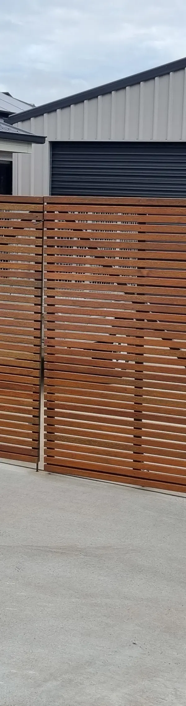 after Wood-look + Black Timber + Powder-coated Steel Sliding Gate – Gate Fabrication, Highfields