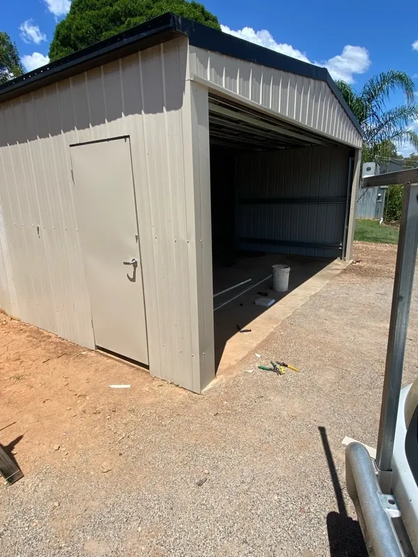 after Cream Colorbond Steel Workshop Door – Additional works: Walls/PA door, Helidon