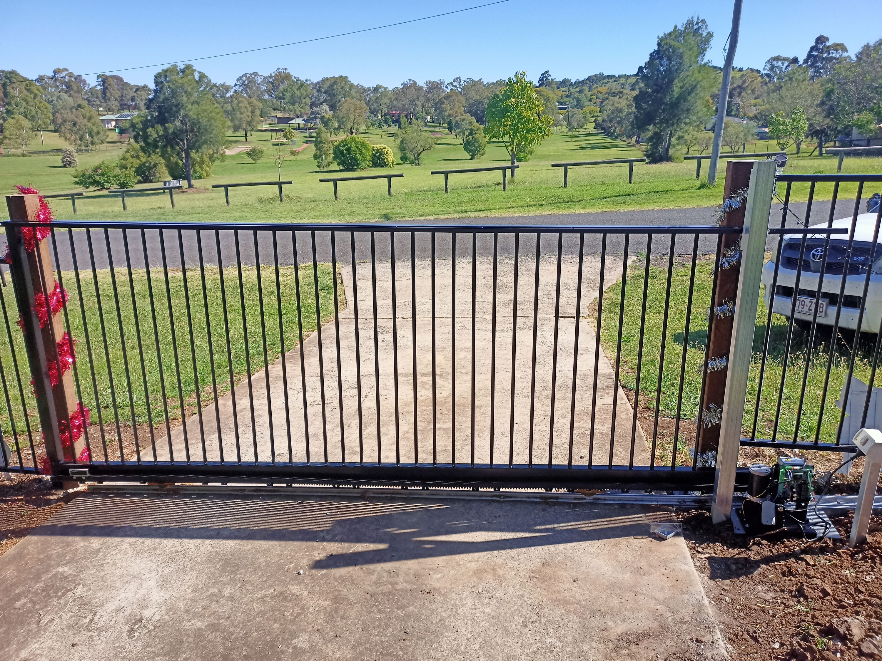 after Black Powder-coated Aluminium Sliding Gate – PIPE GATE + 240V motor, Meringandan West