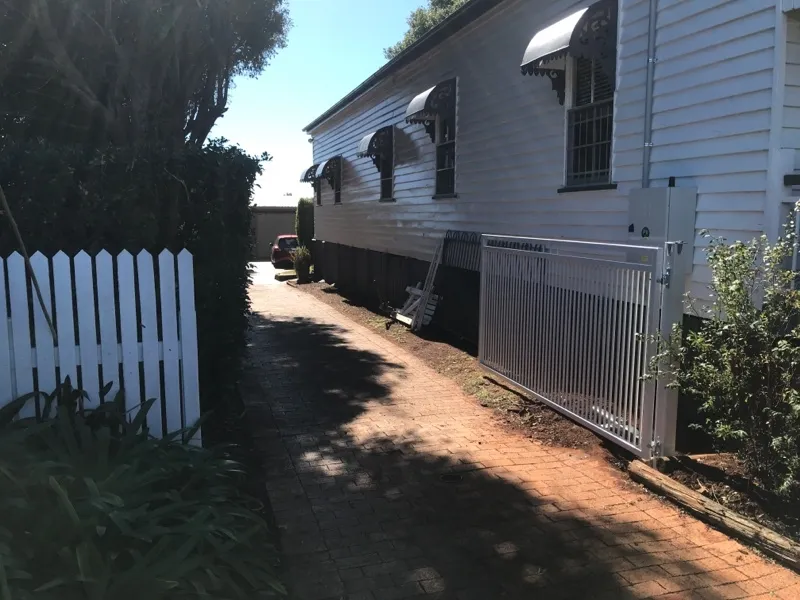 after Wood-look Powder-coated Steel Swing Gate – Pipe Gate + posts, South Toowoomba