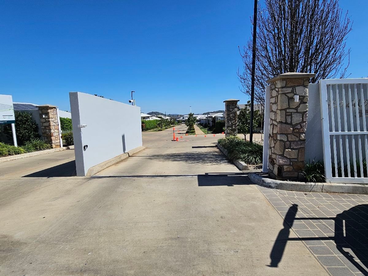 after White Powder-coated Aluminium Sliding Gate – Sliding Gate + Motor, Harristown