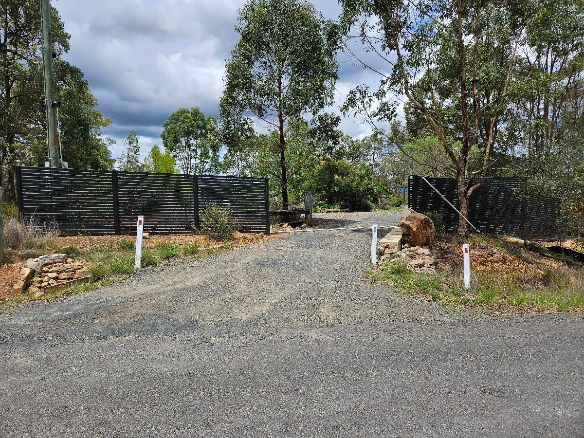 after Monument Colorbond Steel Sliding Gate – Slide Gate + Motor (Monument 1800x5000 Horizontal Slat + Infill Panels + LV Motor + Steel Return), Cabarlah