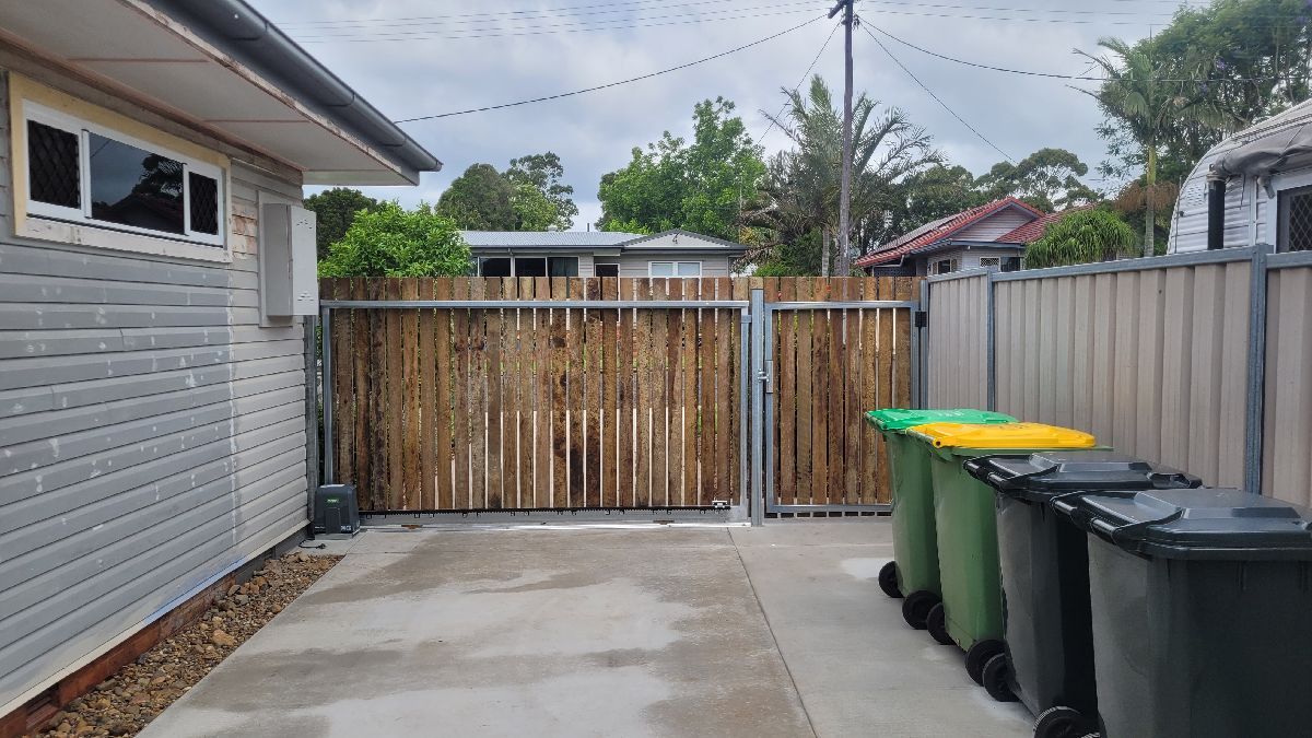 after Wood-look Colorbond + Galvanised Frame Sliding Gate – Steel Gate Frame + Motor, Centenary Heights