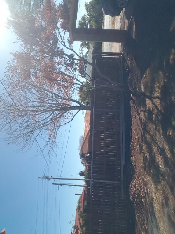 after Wood-look Timber Sliding Gate – GAL GATE/TIMBER PALINGS, Centenary Heights