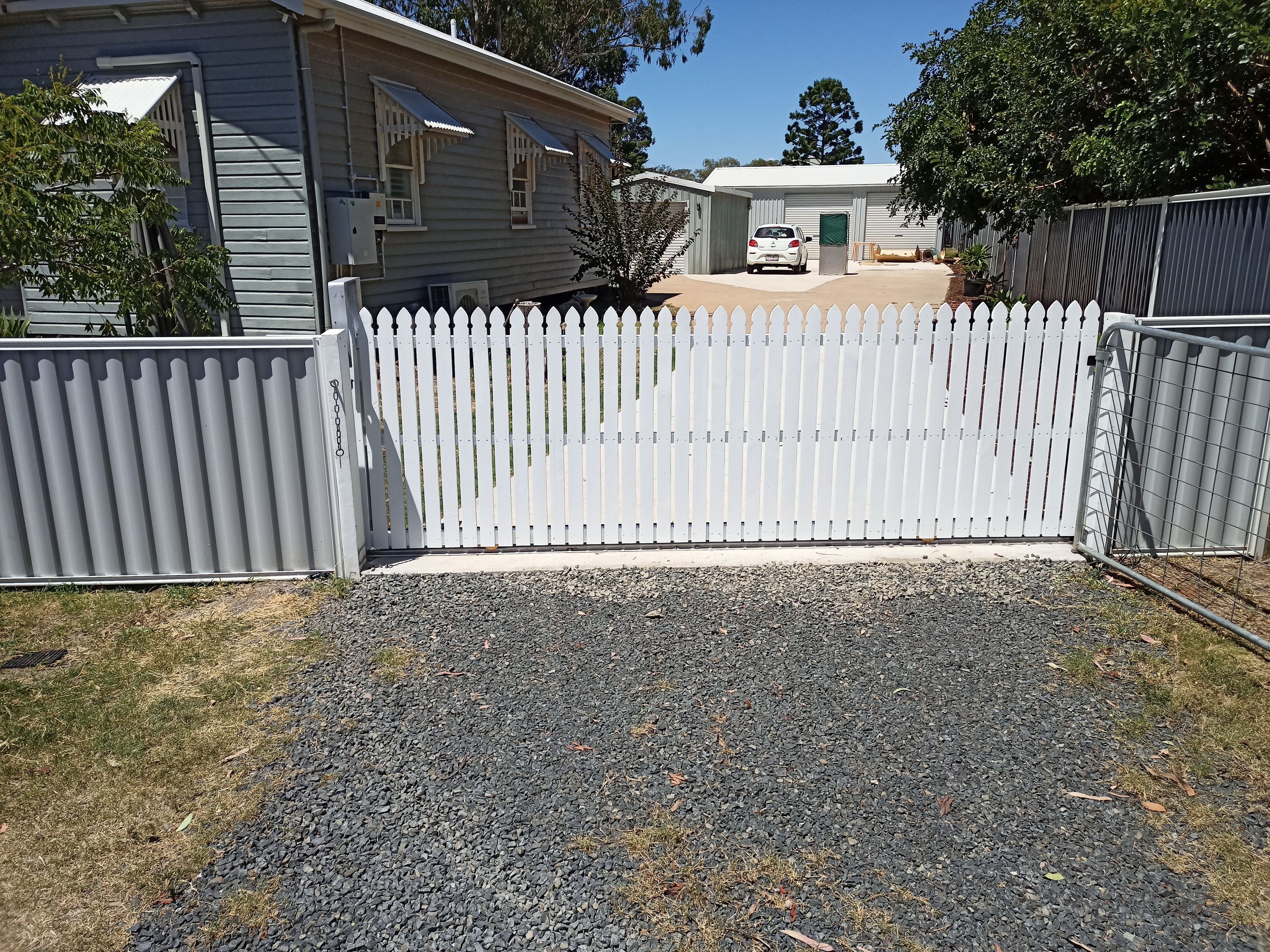 after White Powder-coated Steel + Timber Palings Sliding Gate – Steel Frame, Oakey