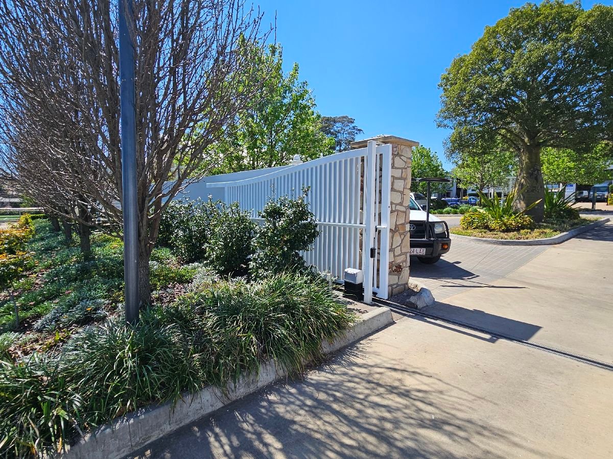 after White Powder-coated Aluminium Sliding Gate – Sliding Gate + Motor, Harristown