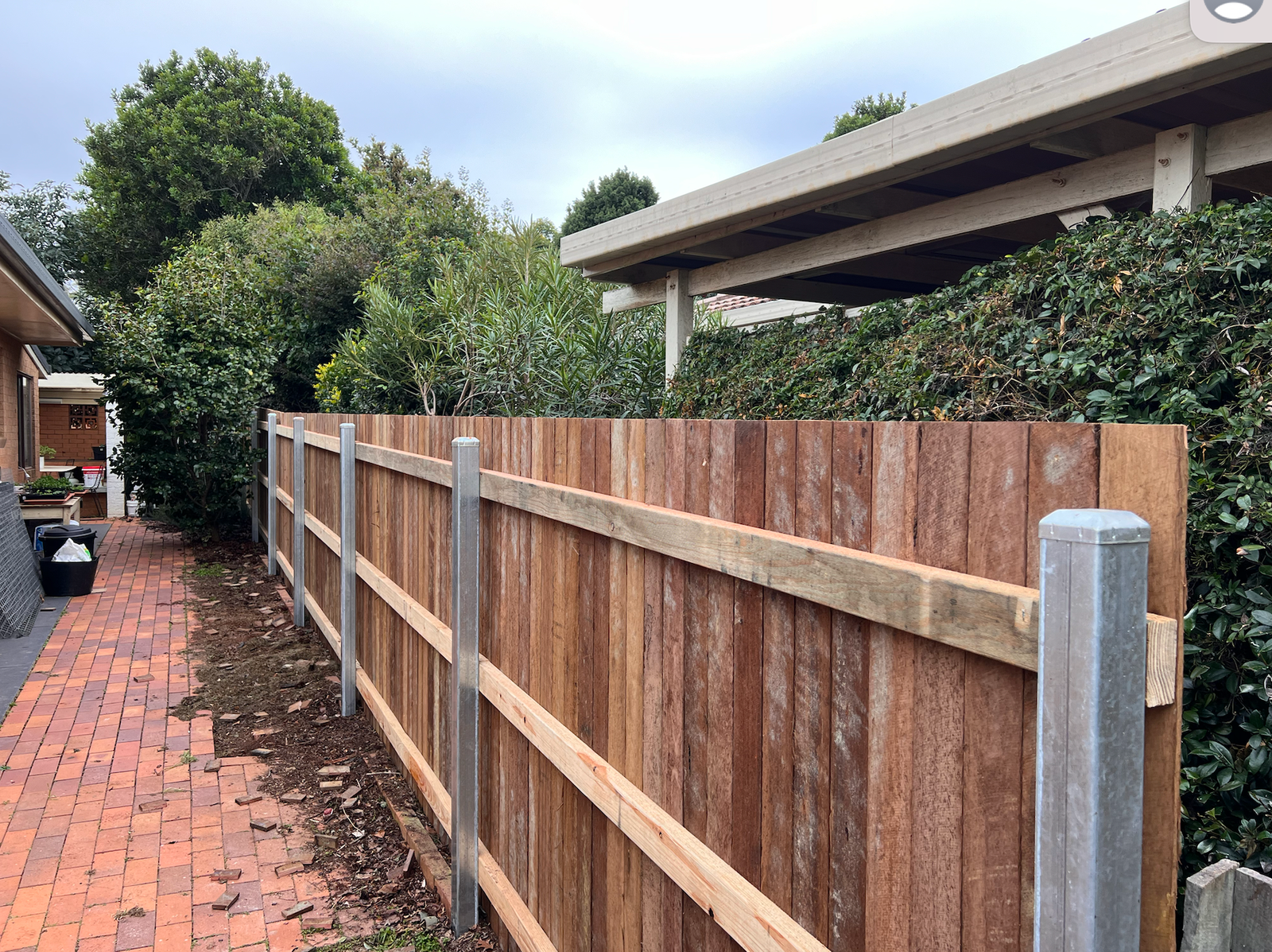 after Wood-look Timber + Galvanised Steel Posts Custom Door – Side Fencing, Rangeville