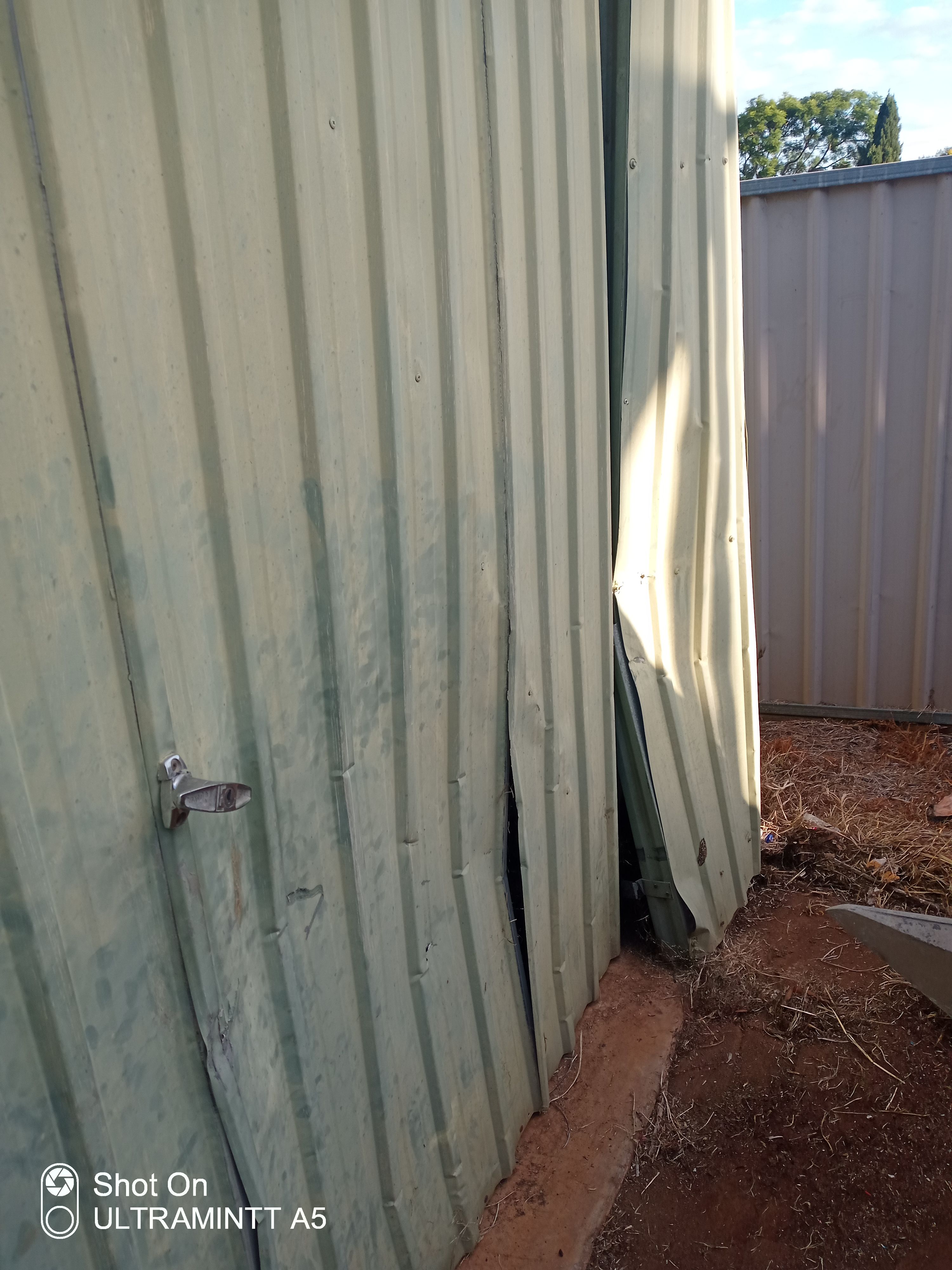 before Galvanised Galvanised Steel Tilt Door – Tilt Door Damage, Wilsonton