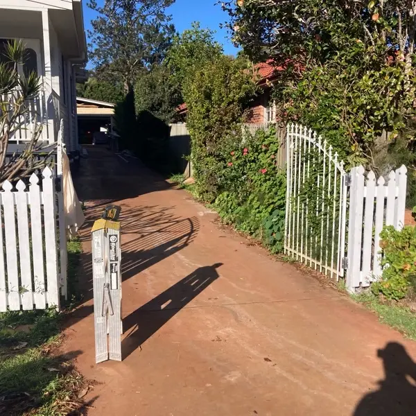 before White Existing Timber Palings Sliding Gate – GAL FRAME (INC RETURN), East Toowoomba