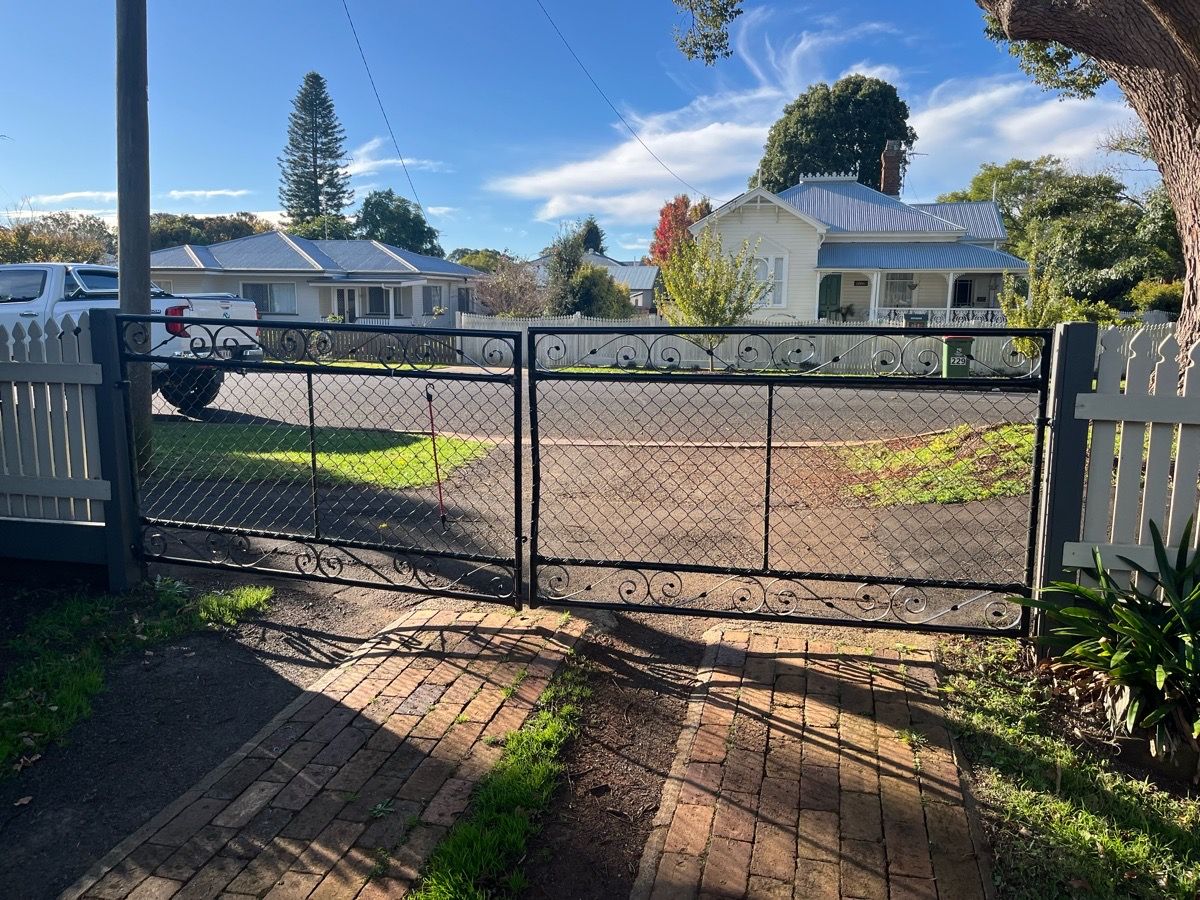 before Black Wrought Iron Swing Gate – Bar Grille + Motor, Newtown