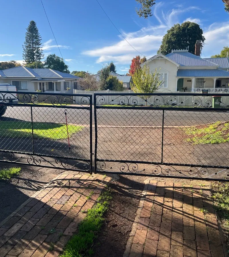 before Black Wrought Iron Swing Gate – Bar Grille + Motor, Newtown