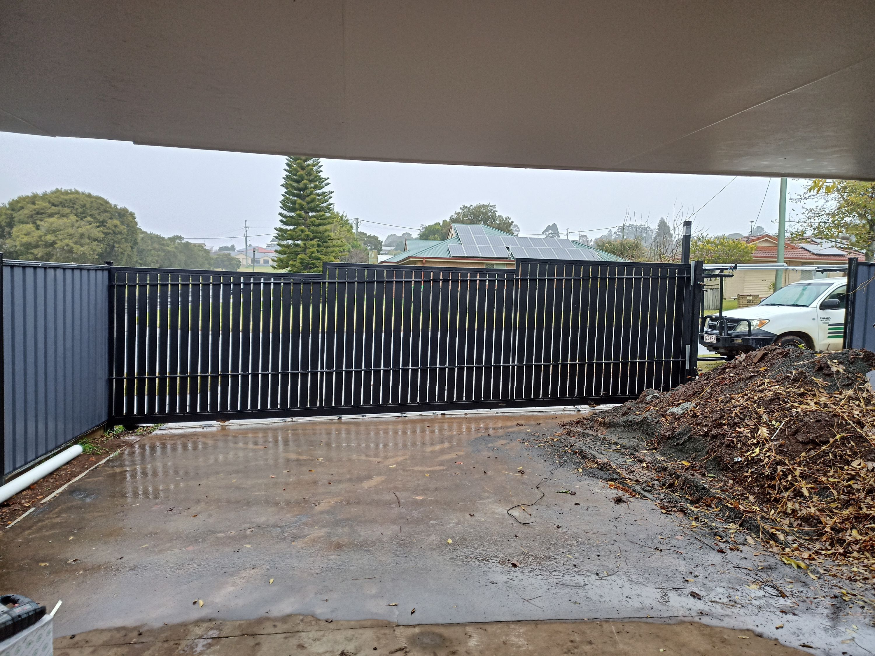 before Black Powder-coated Aluminium Sliding Gate – Aluminium Sliding Gate + Motor, South Toowoomba