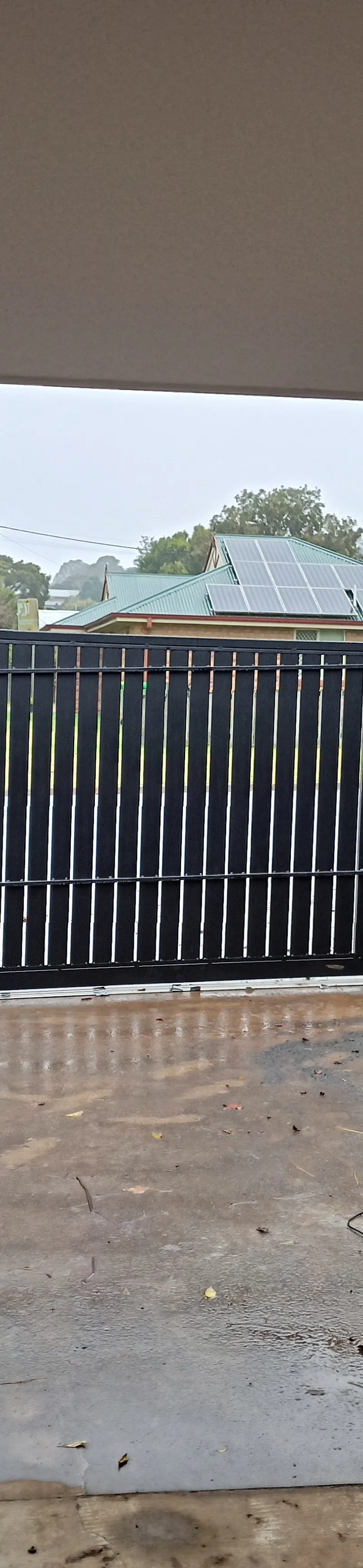 before Black Powder-coated Aluminium Sliding Gate – Aluminium Sliding Gate + Motor, South Toowoomba
